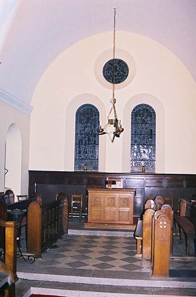 Picture of the church interior west wall in 2001.